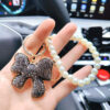 108a4415542a508428b323fc1383f7bc Wholesale Full Diamond Bow Car Creative Pearl Bracelet Keychains