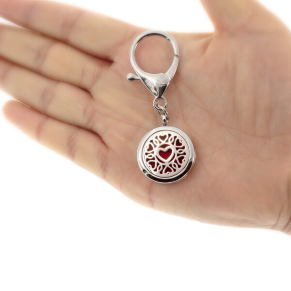 Wholesale 25MM Alloy Dog Paw Tree of Life Hollow Aromatherapy Essential Oil Keychain