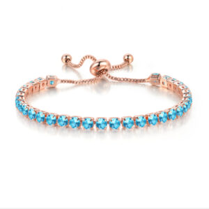 Rose Gold + light blue stone