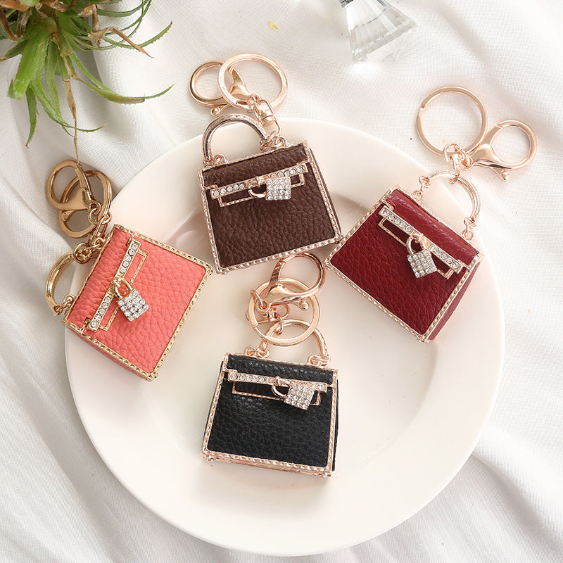 Wholesale Creative Leather Bags with Metal Keychains