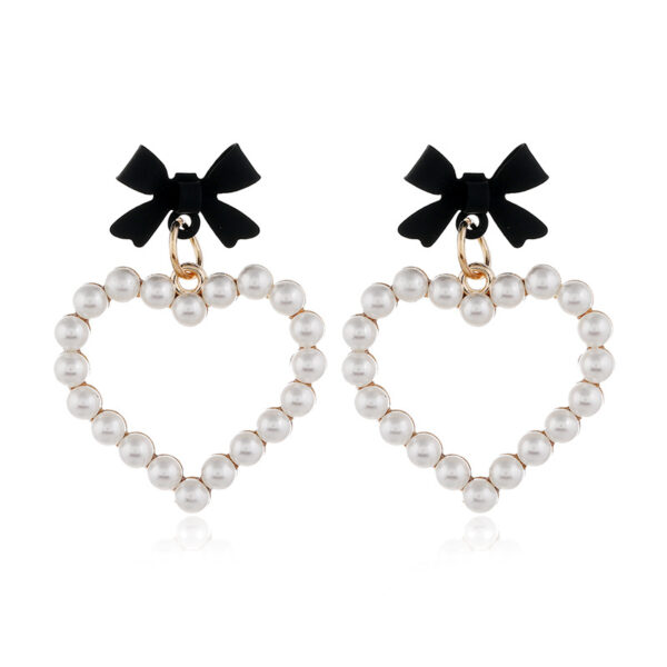 Wholesale Pearl Hollow Heart Shaped Pendant Bow Alloy Earrings