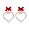 Wholesale Pearl Hollow Heart Shaped Pendant Bow Alloy Earrings