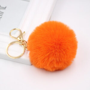Orange. / Gold key chain