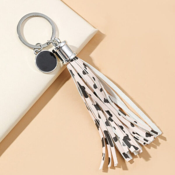 7d4be4efeac4f667d2f3f65e4734b84b Wholesale PU Cow Pattern Tassel Keychain