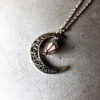 Wholesale Alloy Hollow Moon Heart Birdcage Luminous Beads Pendant Necklace