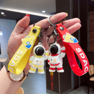 Wholesale Cartoon Waving Astronaut Soft Rubber Keychains