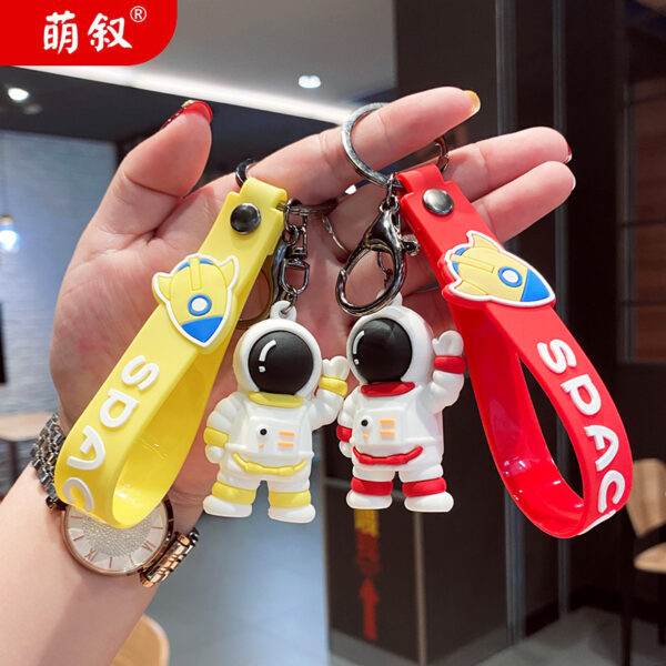 O1CN010YsGw02Bkiaht0Bxi_2210259538377-0-cib Wholesale Cartoon Waving Astronaut Soft Rubber Keychains