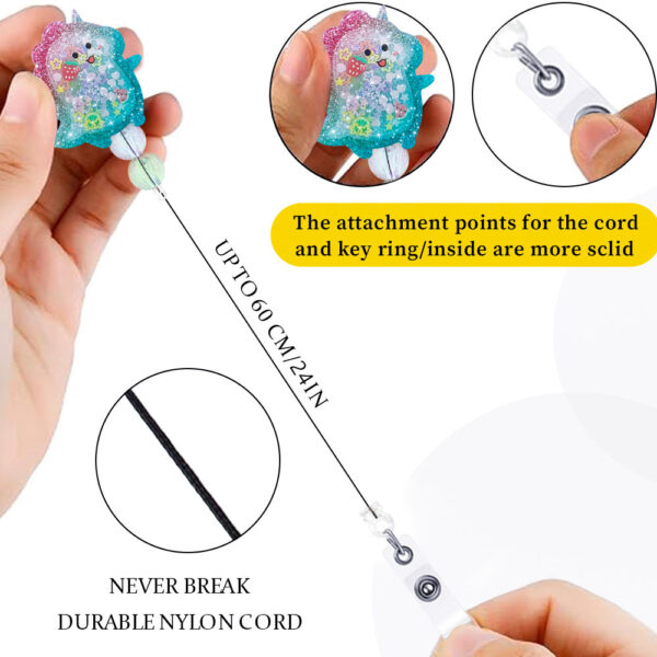 Wholesale Flowing Sand Beaded Dinosaur Smiling Face Milk Tea Cup Emblem Scroll Retractable Plastic Keychain