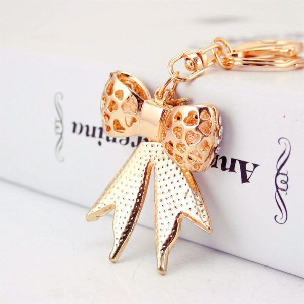 O1CN011hTScA1anL6TbYnVl_2208142583374-0-cib Wholesale Alloy Rhinestone Bow Keychain