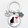 O1CN012vcXiq1hoRS4uIX9W_2216197114324-0-cib Wholesale Love Cat Pet Footprints Dog Glass Convex Round Metal Keychains