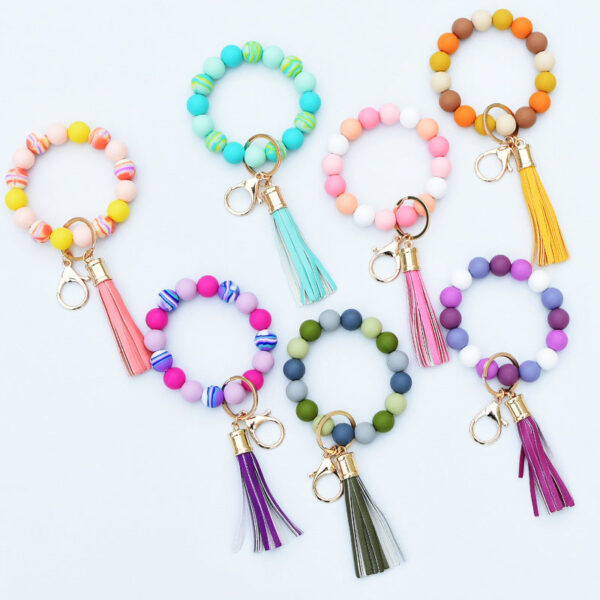 O1CN014bYV5T1N8Ul0ii0CJ__2508931525-0-cib-1 Wholesale Silicone Bead PU Tassel Wrist Keychain