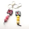 O1CN01590Tj41bYW508YqoD_2216822363477-0-cib Wholesale Cartoon Silicone Beads Acrylic Beads Teacher Keychain