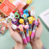 Wholesale Cartoon Cute Head Color Pushing Mini Four Color Plastic Ballpoint Pen