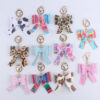 O1CN016EXVUF1NrNf6XCi1q_2214899881623-0-cib Wholesale Cartoon Aztec Color Bow Leather Keychain