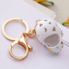 O1CN0171X8YL24ETLxVmvSW_2208216907359-0-cib Wholesale Diamond Spray Painted Skull Alloy Keychain