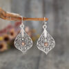 Wholesale Bohemian Retro Style Teardrop-shaped Hollow Pattern Inlaid Gem Alloy Earrings