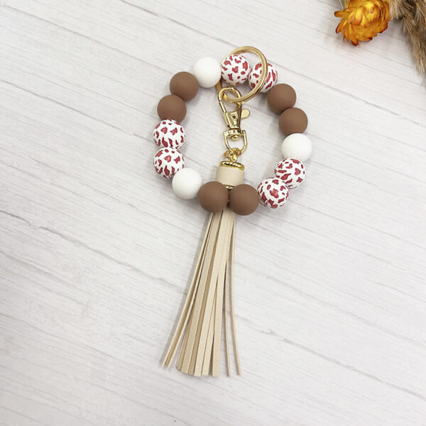 O1CN0175rC7T1tKvNVWhT1C_2207986825884-0-cib Wholesale Western Style Cow Grain Wood Beads Silicone Handmade Keychain Bag Key Accessories