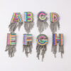 O1CN018DvcqW2LwImq8YbP1__3077749756-0-cib Wholesale Colorful Diamond Letter Tassel Brooch