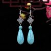 O1CN018XwiDe2CXixAEh8oY_2212424078484-0-cib Wholesale Flower Tassel Alloy Earrings