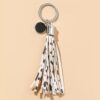 O1CN0192GPQT1bFjfKVfxTi_2857743436-0-cib Wholesale PU Cow Pattern Tassel Keychain