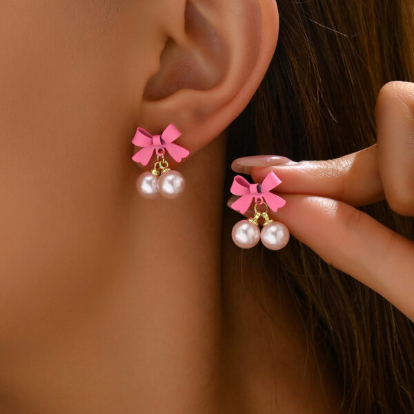 O1CN019Kc0dH1TX7xVBLjja_2208880022391-0-cib Wholesale Simple Bow Inlaid Pearl Earrings