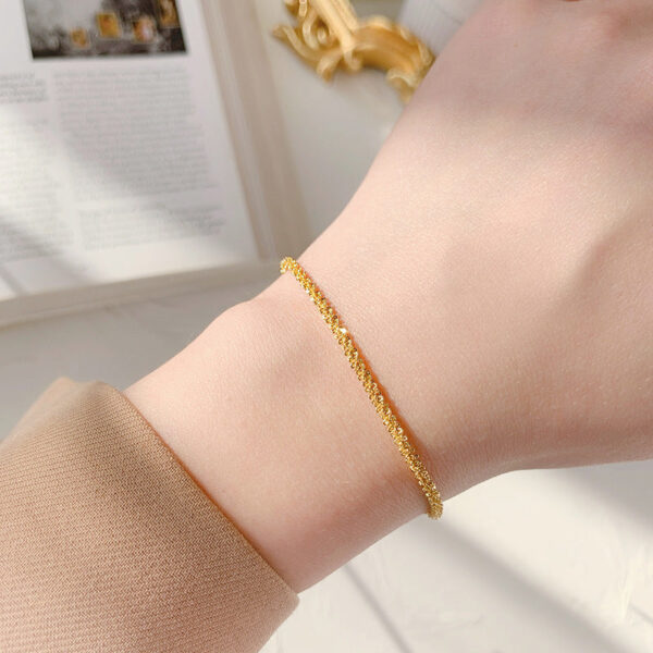 O1CN019OHW5n1mNwX9tp2NX__2214535184943-0-cib Wholesale Sparkling Twist Chain Titanium Steel 18K Gold Bracelet