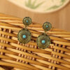 Wholesale Retro Ethnic Style Golden Pumpkin Flower Inlaid Turquoise Long Alloy Earrings