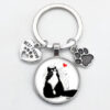 O1CN01BzbM8P1hoRS64fvwj__2216197114324-0-cib Wholesale Love Cat Pet Footprints Dog Glass Convex Round Metal Keychains