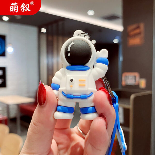 O1CN01C02uyx2BkiaYnGzGh_2210259538377-0-cib Wholesale Cartoon Waving Astronaut Soft Rubber Keychains