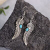 O1CN01CJQreC1qyMWfFgXl3_2206372095564-0-cib Wholesale Vintage Turquoise Feather Alloy Earrings