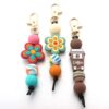 O1CN01DHHGfT1bYW5MiiSIw_2216822363477-0-cib Wholesale Cartoon Flower Coffee Silicone Beads Keychain
