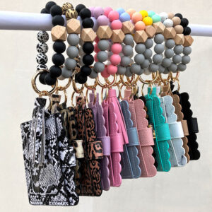 O1CN01ELuwvi1N8UnLHKnUh__2508931525-0-cib-2 Wholesale Colorful Silicone Beads PU Tassel Coin Purse Wrist Keychain
