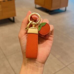 Orange keychain + orange with golden horseshoe buckle