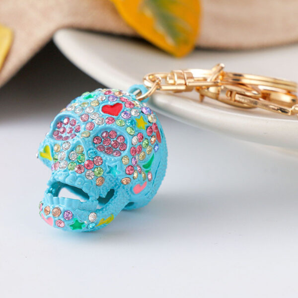 O1CN01FguBGS24ETLs91IXP_2208216907359-0-cib Wholesale Diamond Spray Painted Skull Alloy Keychain