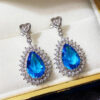 O1CN01Hu9UNo1jNXG3BhBiJ_3551054536-0-cib Wholesale Water Drop Blue Zircon Blue Gemstone Earrings
