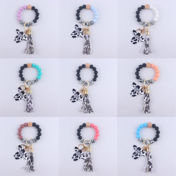 O1CN01ILOBwX1NrNdq5Eg8M_2214899881623-0-cib Wholesale MAMA Wood Chips Cow Head Western Style Silicone Beads Wrist Keychain