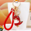 O1CN01IPHqTS2MmyOsyyKhx_2204146159871-0-cib Wholesale Water Diamond Dinosaur Doll Zinc Alloy Keychain