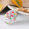 O1CN01IV6vux24ETLs8yoh7__2208216907359-0-cib Wholesale Diamond Spray Painted Skull Alloy Keychain