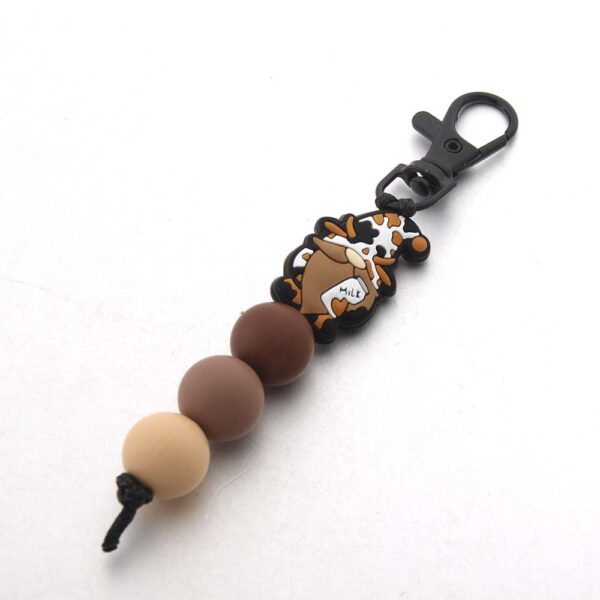O1CN01IWfZAB1bYW5kgp8lU_2216822363477-0-cib Wholesale Cartoon Animal Dwarf English Letter Bull Head Silicone Bead Keychain