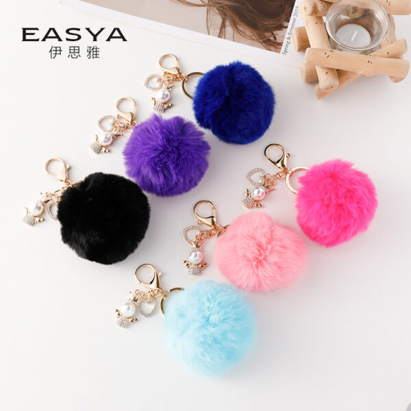 Wholesale of Cute Diamond Inlaid Angel Fur Ball Metal Keychains