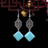O1CN01JBIp2r2CXiwuyhxHT_2212424078484-0-cib Wholesale Flower Tassel Alloy Earrings