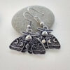 O1CN01JPC00f1EYkzmobpaJ__2215129220364-0-cib Wholesale Gothic Silver Moth-alloy Earrings with Moon and Sun Pattern Alloy Earrings
