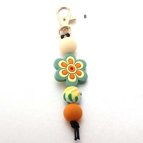 O1CN01JTQzfN1bYW5MihiY8_2216822363477-0-cib Wholesale Cartoon Flower Coffee Silicone Beads Keychain