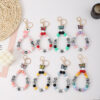 O1CN01JWqe6R1FGj2aNJZEN_2949020460-0-cib Wholesale Rubber Tassel Silicone Wood Water Keychain