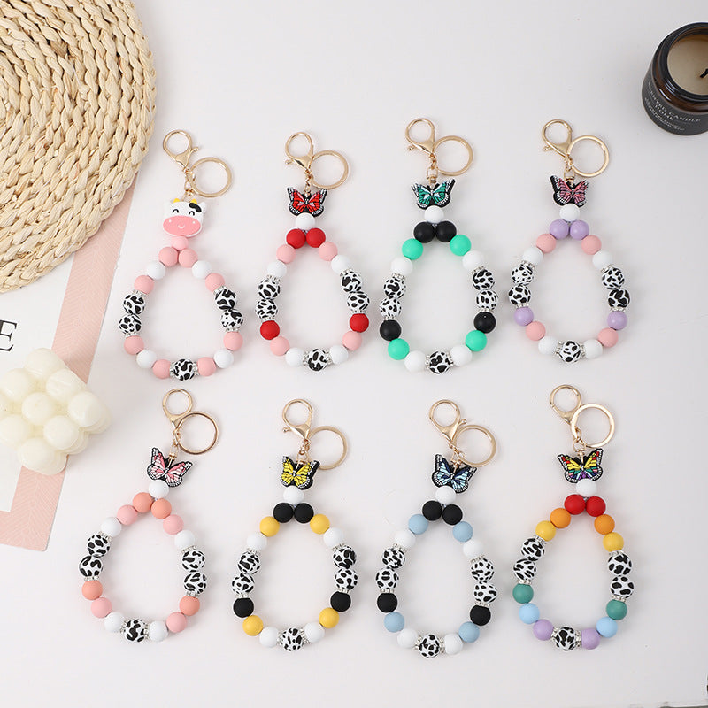 Wholesale Rubber Tassel Silicone Wood Water Keychain