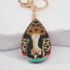 O1CN01JocLL61jN4zsfaas5_2213351114535-0-cib Wholesale Western Leopard Cow Sun Flower Metal Keychain