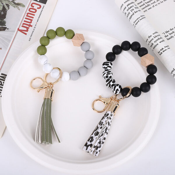 O1CN01KJW1uB1FT5ZVsHvbn_2698260487-0-cib-2 Wholesale Tassel Wood Beads Silicone Keychains