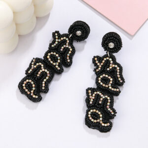 "a pair of black english ""mama"" rice bead earrings"