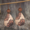 O1CN01Mk0mXk1qyMb8KWyb7_2206372095564-0-cib Wholesale Western Style Sunflower Vintage Wood Chip Carved Water Drop Earrings