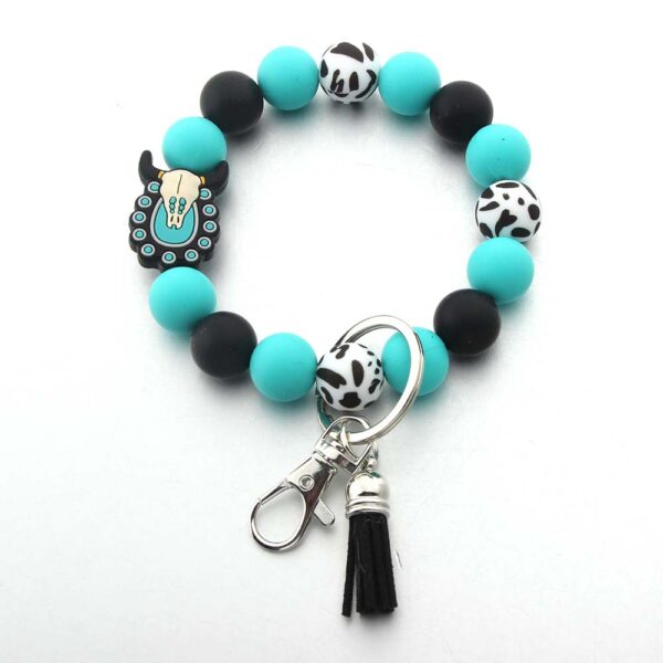 O1CN01N2WVgt1bYW4rOSmxa_2216822363477-0-cib Wholesale Cartoon Animal Western Cowboy Silicone Tassel Bracelet Keychain